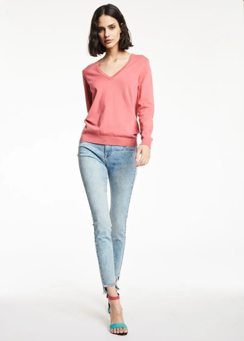 Jeans jeggings con orlo a taglio vivo